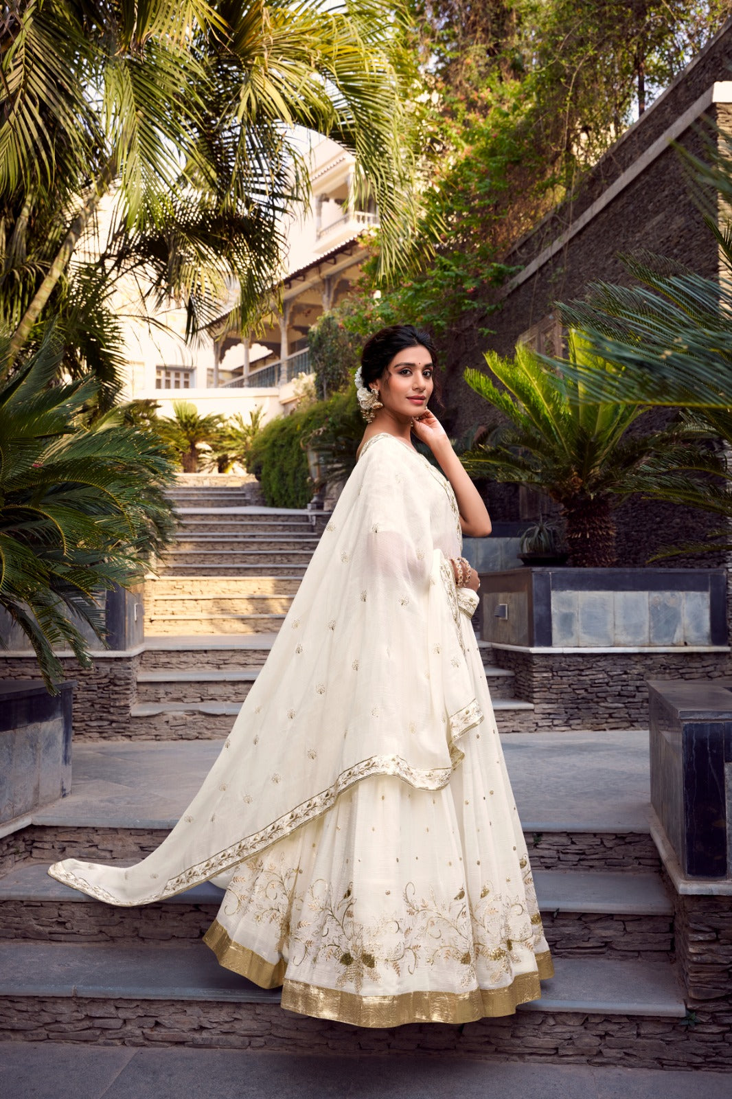 FEALDEAL presents elegant stitched lehenga choli in silver with sequins & foil embroidery. Trendy lehenga set for women & girls. Shop wedding lehenga choli online now!